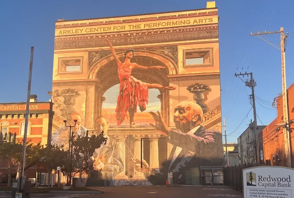 Trompe-l'œil mural of a dancer and conductor on the Arkley Center for the Performing Arts, Eureka