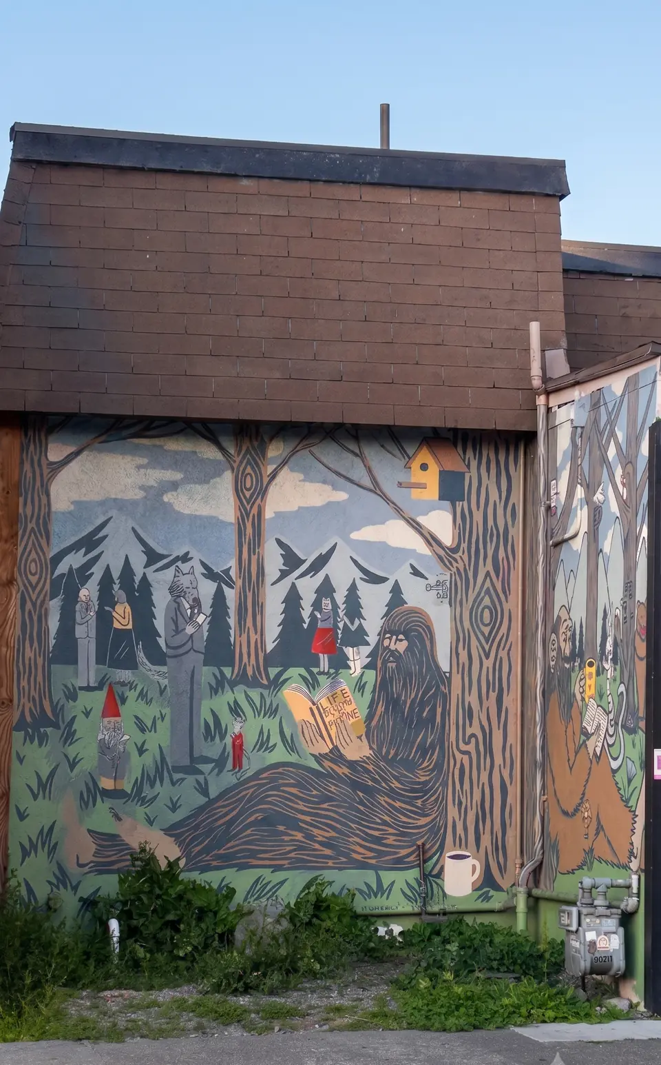 Mural of Bigfoot reading a scroll among redwoods, gnomes and a coffee cup